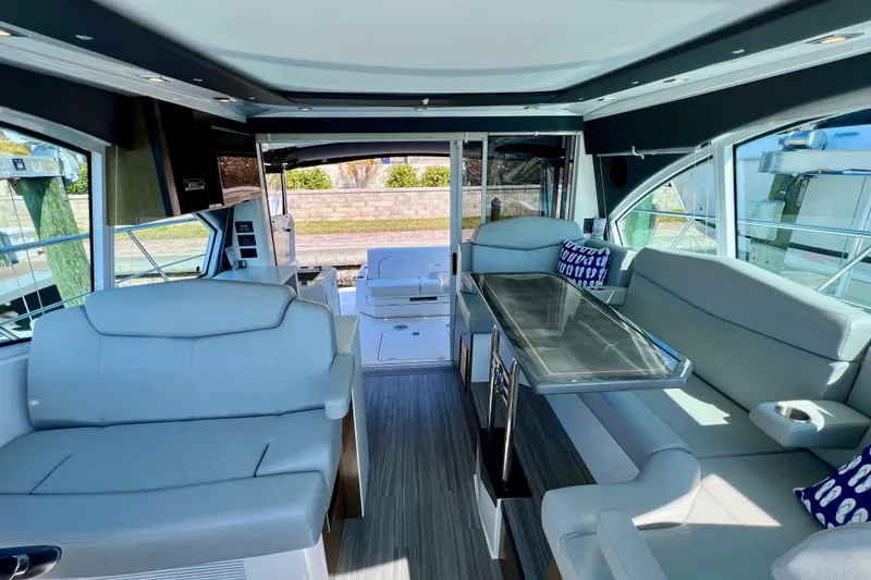 Slide: The Image of Luxurious interior of 2018 Cruisers Yachts 41 Cantius with modern seating and dining area. - 46