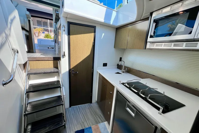 Slide: The Image of Modern kitchen interior of 2018 Cruisers Yachts 41 Cantius with sleek design and appliances. - 49