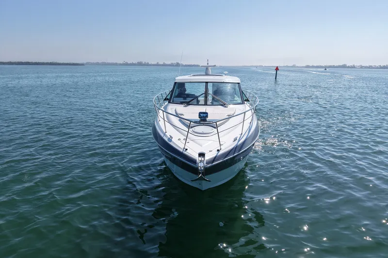 Slide: The Image of 2018 Cruisers Yachts 41 Cantius on calm blue water, front view. - 5