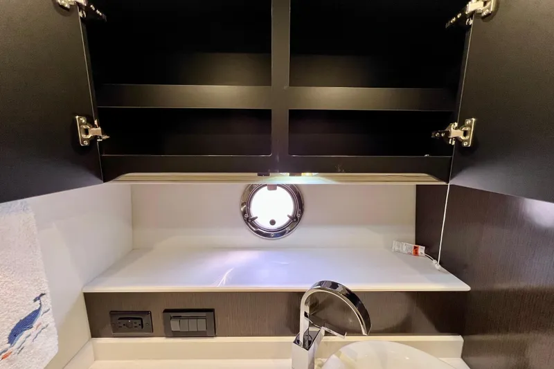 Slide: The Image of 2018 Cruisers Yachts 41 Cantius bathroom with open cabinet and modern fixtures. - 59