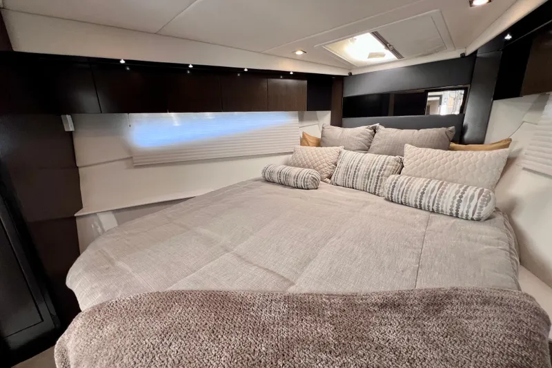 Slide: The Image of Luxurious bedroom interior of 2018 Cruisers Yachts 41 Cantius with plush bedding and modern design. - 62