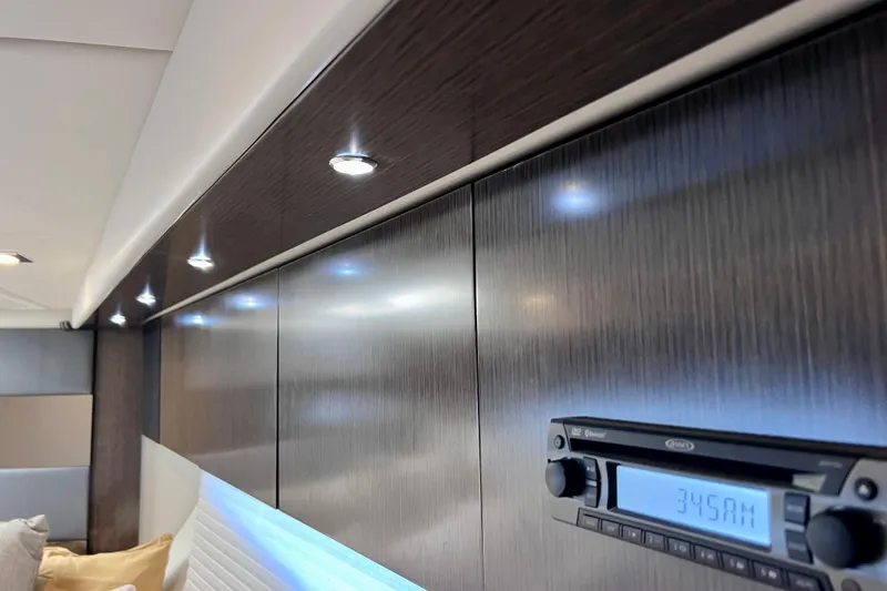 Slide: The Image of Interior of 2018 Cruisers Yachts 41 Cantius with sleek wood paneling and modern lighting. - 65