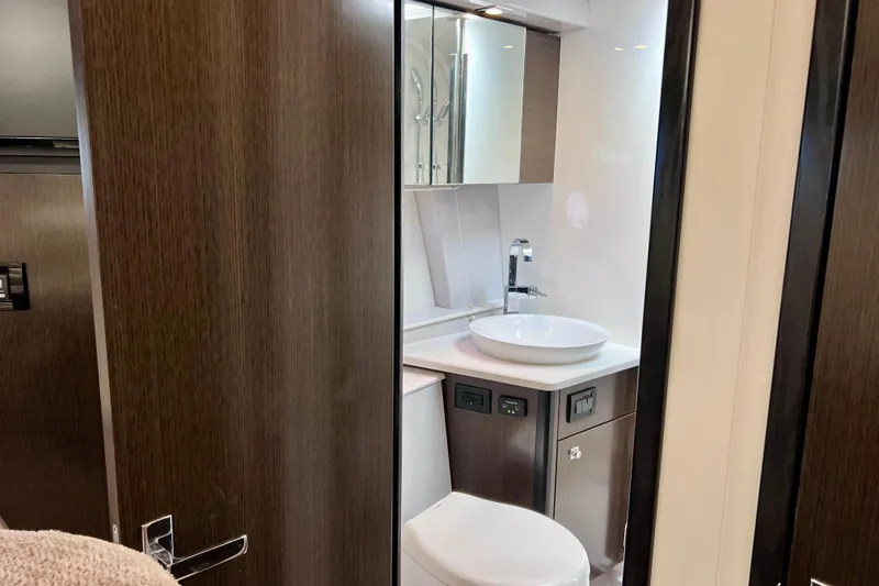 Slide: The Image of Luxurious bathroom interior of 2018 Cruisers Yachts 41 Cantius, featuring modern fixtures and wood accents. - 67