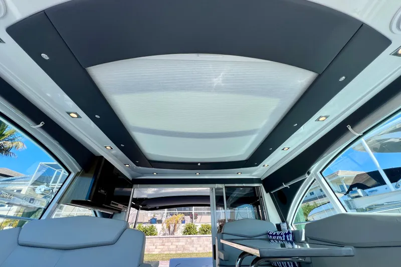 Slide: The Image of Interior view of 2018 Cruisers Yachts 41 Cantius, featuring modern seating and sleek design. - 70