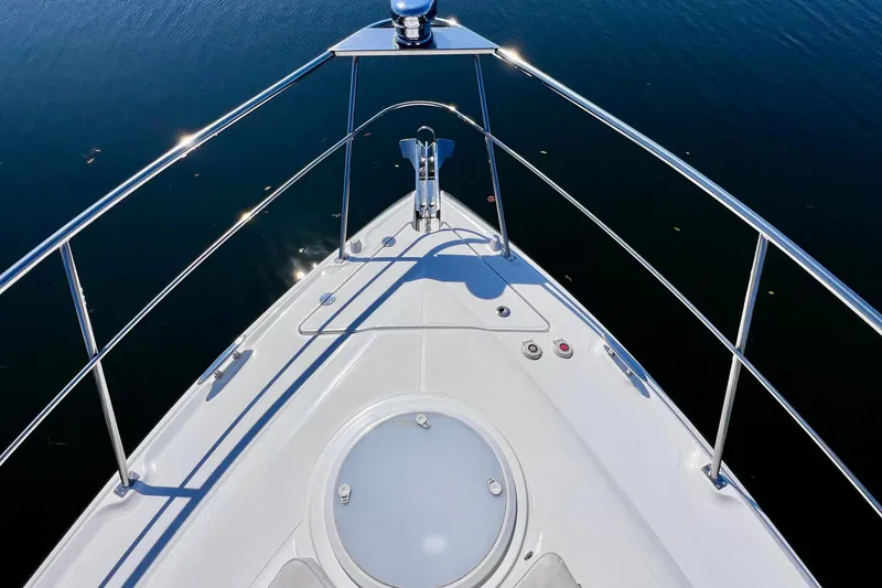 Slide: The Image of Bow view of 2018 Cruisers Yachts 41 Cantius on calm water. - 78