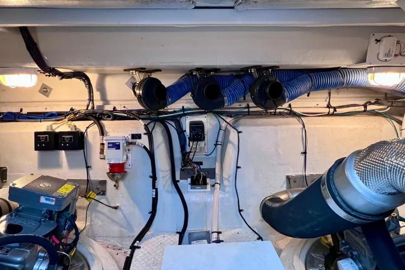 Slide: The Image of Engine room of 2018 Cruisers Yachts 41 Cantius with visible wiring and ventilation. - 85
