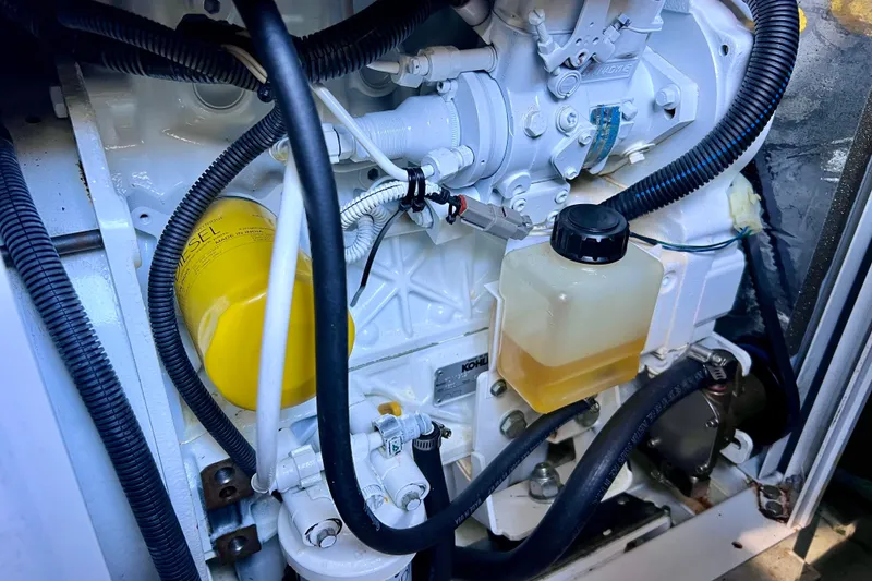 Slide: The Image of Engine compartment of 2018 Cruisers Yachts 41 Cantius, featuring diesel components and wiring. - 92