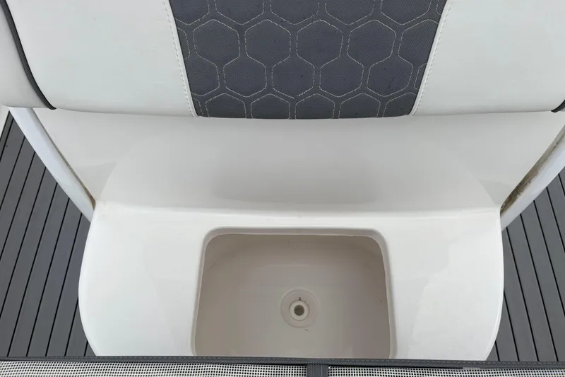 Slide: The Image of 2019 Tidewater 232 CC Adventure boat seat and storage compartment detail. - 10