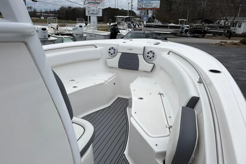 Slide: The Image of 2019 Tidewater 232 CC Adventure boat interior with seating and speakers. - 15