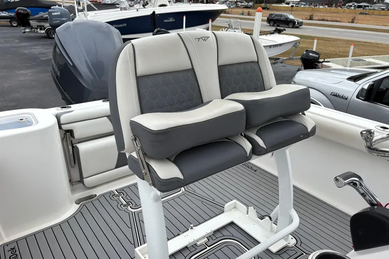 Slide: The Image of 2019 Tidewater 232 CC Adventure boat seats with gray and white upholstery. - 17