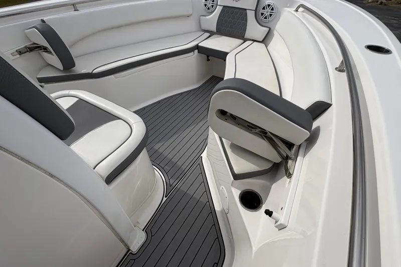 Slide: The Image of 2019 Tidewater 232 CC Adventure boat interior with gray and white seating and flooring. - 23