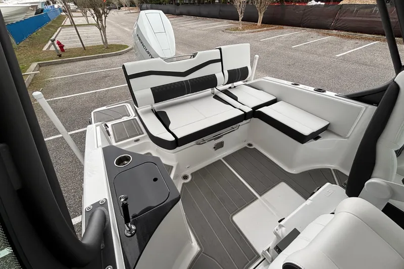 Slide: The Image of 2026 Monterey Elite 25 OB boat interior with sleek seating and modern design. - 10