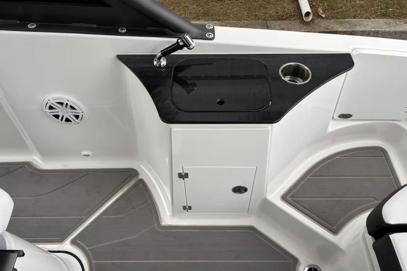 Slide: The Image of Interior of 2026 Monterey Elite 25 OB boat with sink and storage area. - 11