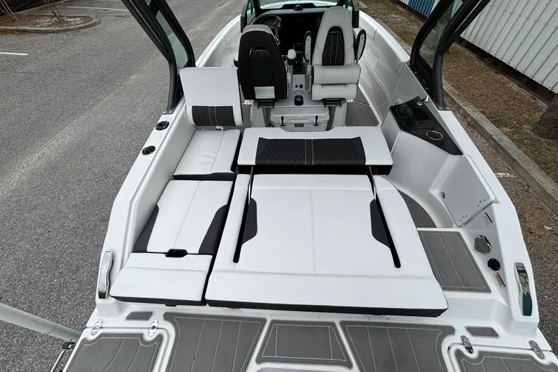 Slide: The Image of 2026 Monterey Elite 25 OB boat interior with sleek seating and modern design. - 14