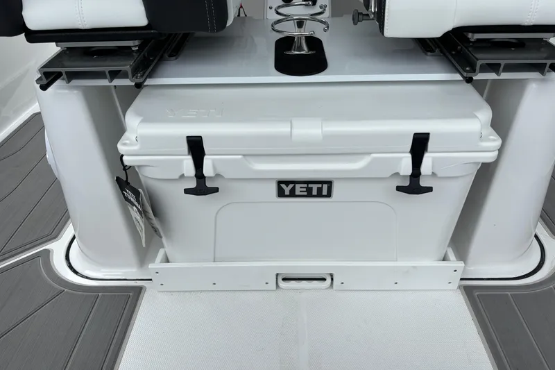 Slide: The Image of YETI cooler on 2026 Monterey Elite 25 OB boat deck, featuring sleek design and functionality. - 20