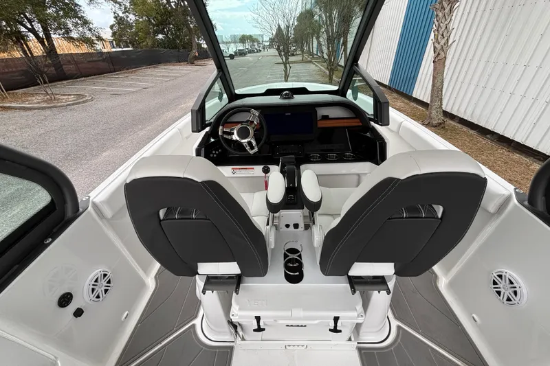 Slide: The Image of 2026 Monterey Elite 25 OB boat interior with modern helm and seating. - 22