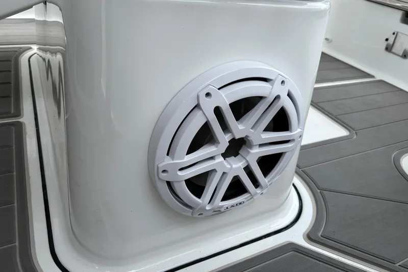 Slide: The Image of Speaker on 2026 Monterey Elite 25 OB boat, featuring sleek design and modern flooring. - 30
