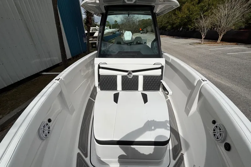 Slide: The Image of 2026 Monterey Elite 25 OB boat interior with sleek seating and modern design. - 34