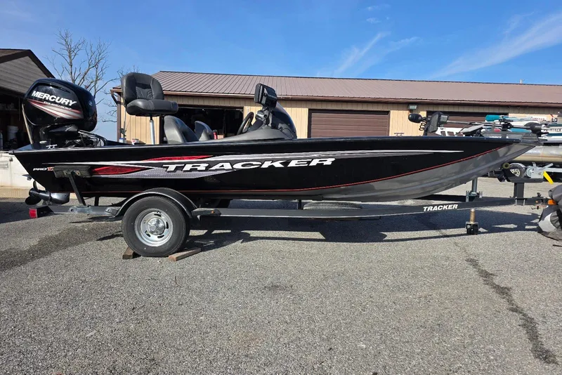 The Image of 2019 Tracker Pro Team 175 TXW boat on trailer, parked outdoors. - 0