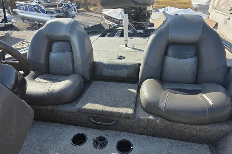 Slide: The Image of 2019 Tracker Pro Team 175 TXW boat interior with two cushioned seats. - 15
