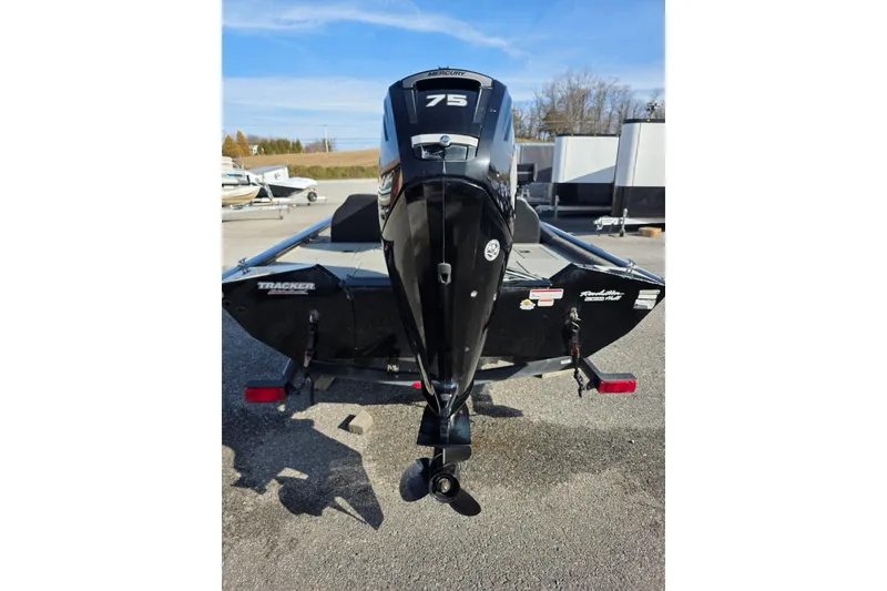 Slide: The Image of 2019 Tracker Pro Team 175 TXW boat with Mercury 75 engine, parked outdoors. - 5