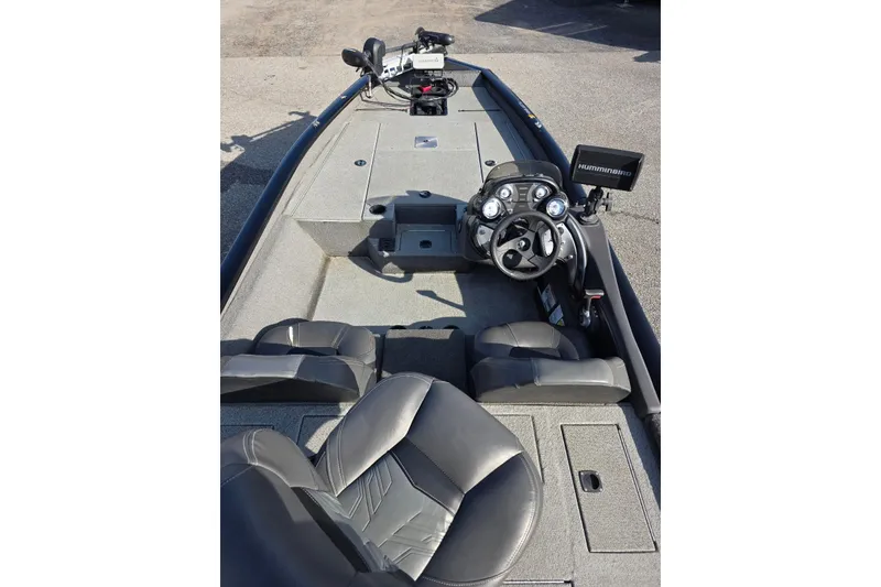 Slide: The Image of 2019 Tracker Pro Team 175 TXW boat interior with steering console and seating. - 6