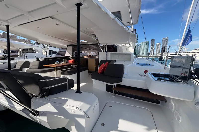 Slide: The Image of Luxurious 2025 Fountaine Pajot 41 catamaran interior with modern seating and dining area. - 16