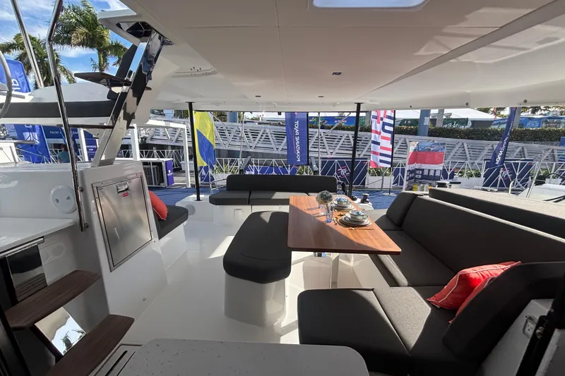 Slide: The Image of Luxurious interior of 2025 Fountaine Pajot 41 catamaran with elegant seating and dining area. - 19