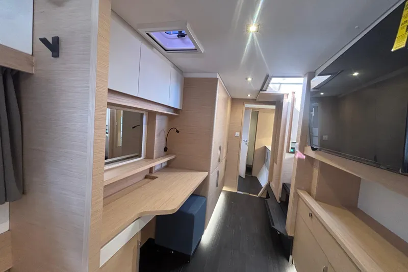Slide: The Image of Modern interior of 2025 Fountaine Pajot 41 yacht with sleek wood finishes and ample lighting. - 24