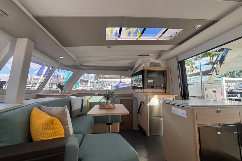 Slide: The Image of Luxurious interior of 2025 Fountaine Pajot 41 catamaran with modern furnishings and panoramic windows. - 3