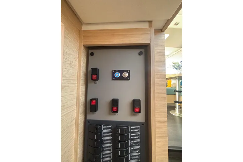 Slide: The Image of Control panel inside 2025 Fountaine Pajot 41 yacht, featuring switches and labels. - 32