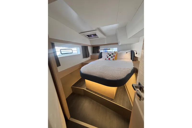 Slide: The Image of Luxurious cabin interior of 2025 Fountaine Pajot 41 yacht, featuring a cozy bed and modern design. - 33