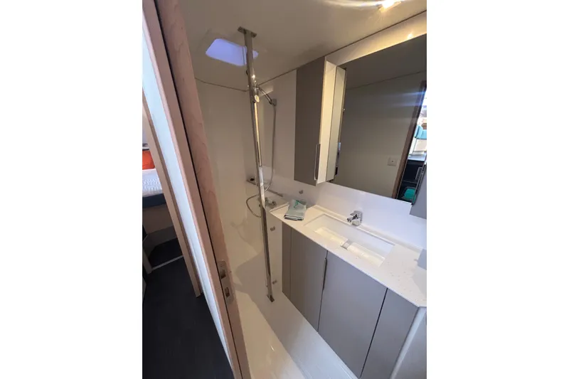 Slide: The Image of Modern bathroom in 2025 Fountaine Pajot 41 yacht with sleek fixtures and ample storage. - 34