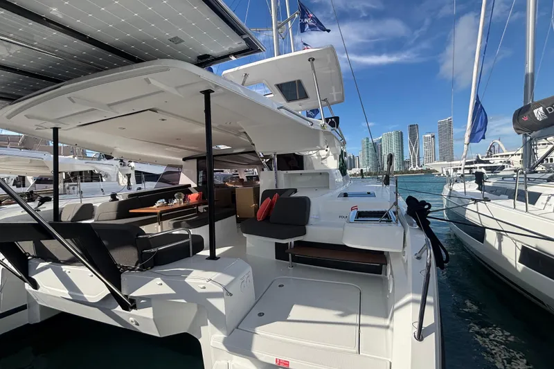 Slide: The Image of 2025 Fountaine Pajot 41 catamaran docked, featuring spacious deck and modern design. - 6