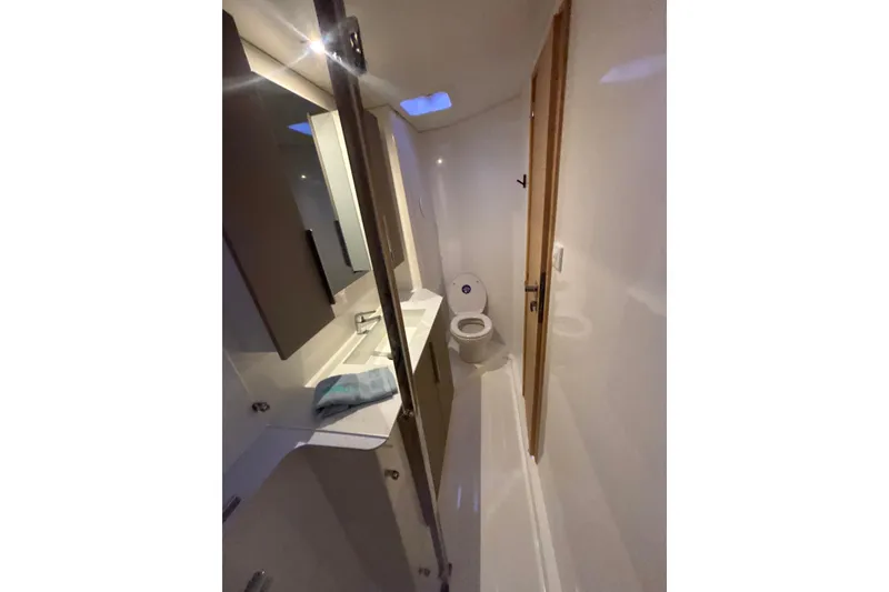 Slide: The Image of Luxurious cabin interior of 2025 Fountaine Pajot 41 yacht, featuring a cozy bed and modern design. - 35