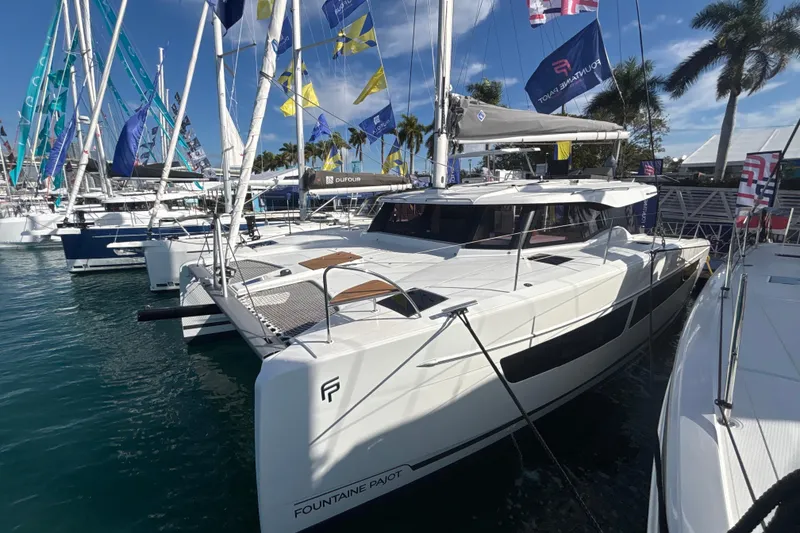 Slide: The Image of Luxurious interior of 2025 Fountaine Pajot 41 catamaran with modern furnishings and panoramic windows. - 5