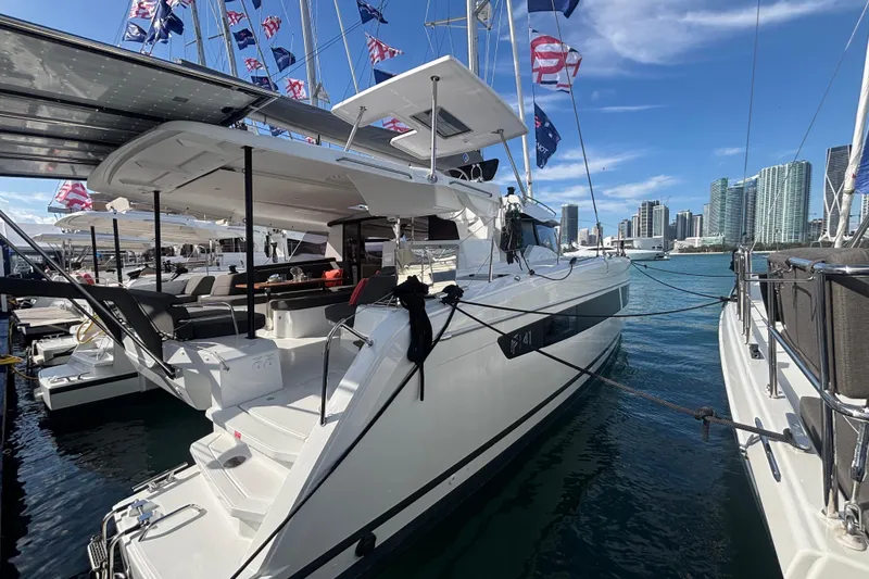Slide: The Image of 2025 Fountaine Pajot 41 catamaran docked, featuring spacious deck and modern design. - 8