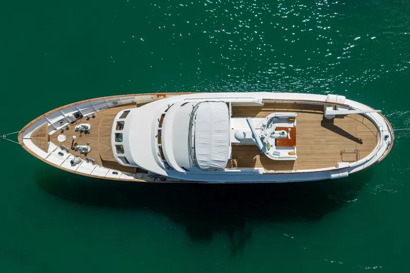 Slide: The Image of Overhead view of 1989 Moonen 85 Long Range Cruiser yacht on green water. - 10