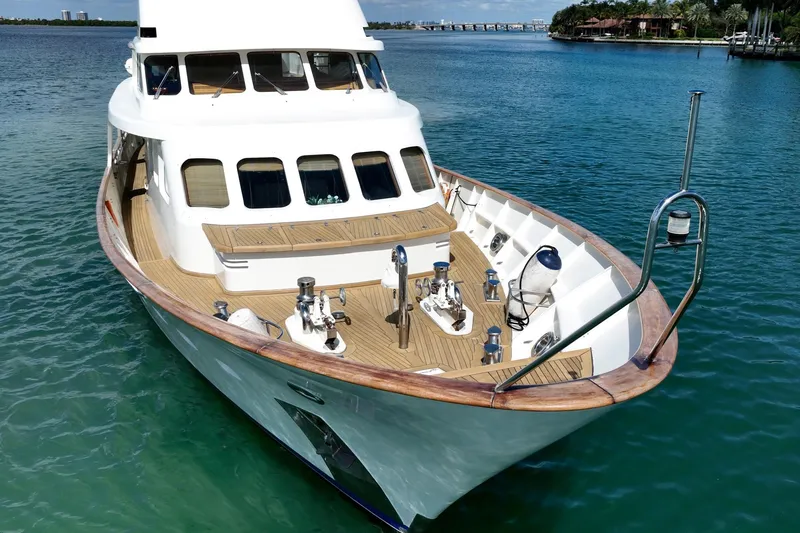 Slide: The Image of Moonen 85 Long Range Cruiser 1989 yacht on clear blue water, showcasing elegant design. - 11