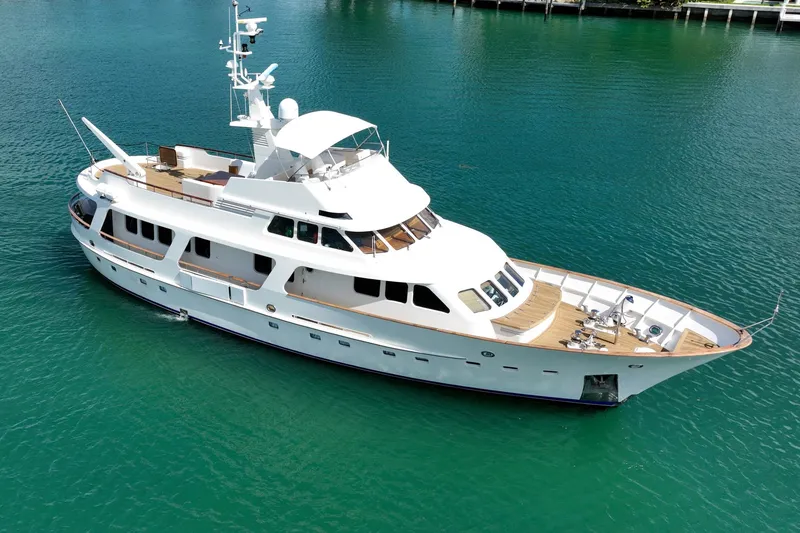 Slide: The Image of Moonen 85 Long Range Cruiser yacht, 1989 model, on clear turquoise water. - 12