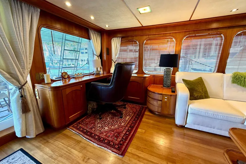 Slide: The Image of Luxurious interior of 1989 Moonen 85 Long Range Cruiser with elegant wood and plush seating. - 19