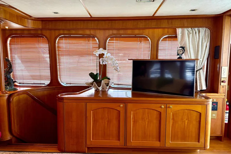 Slide: The Image of Luxurious wooden interior of 1989 Moonen 85 Long Range Cruiser yacht with TV and decor. - 20