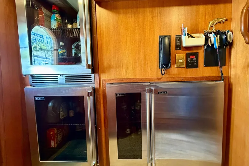 Slide: The Image of Interior of 1989 Moonen 85 Long Range Cruiser with stainless steel appliances and wooden paneling. - 25