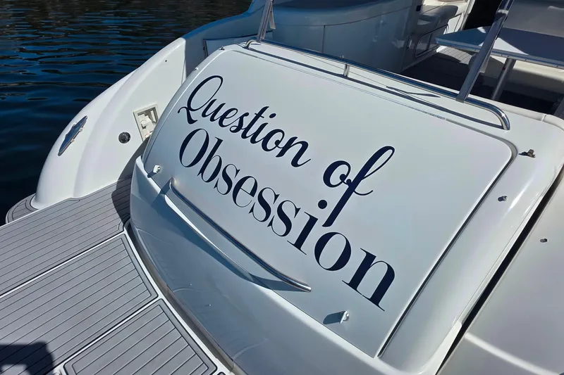 Slide: The Image of 2002 Formula 370 Super Sport boat with "Question of Obsession" text on the stern. - 11