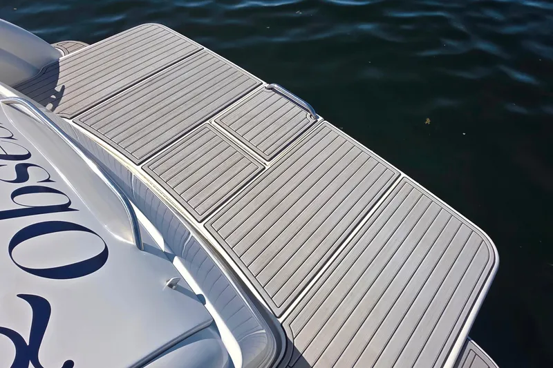 Slide: The Image of 2002 Formula 370 Super Sport boat swim platform on calm water. - 12