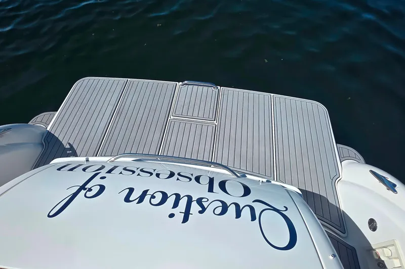 Slide: The Image of 2002 Formula 370 Super Sport boat with custom lettering on deck, floating on water. - 21