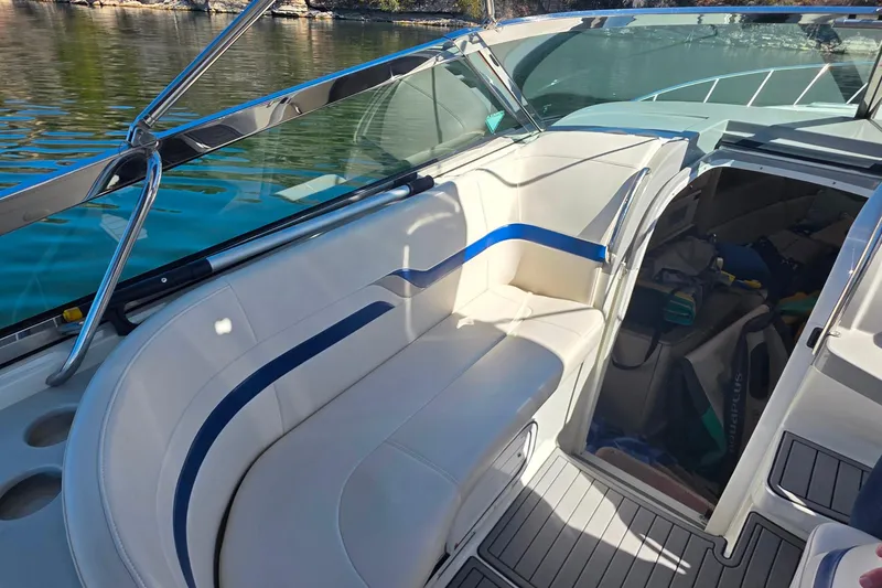 Slide: The Image of 2002 Formula 370 Super Sport boat interior with white seating and open cabin. - 23