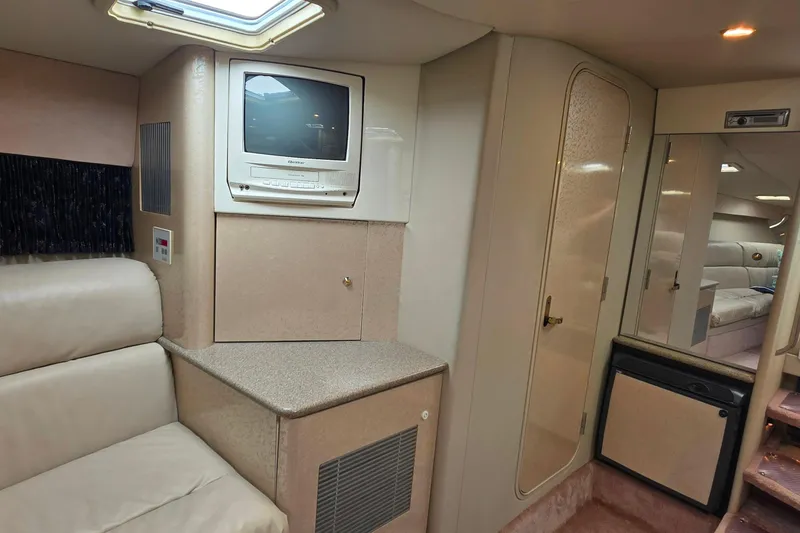 Slide: The Image of Interior of 2002 Formula 370 Super Sport boat with TV, seating, and compact design. - 37