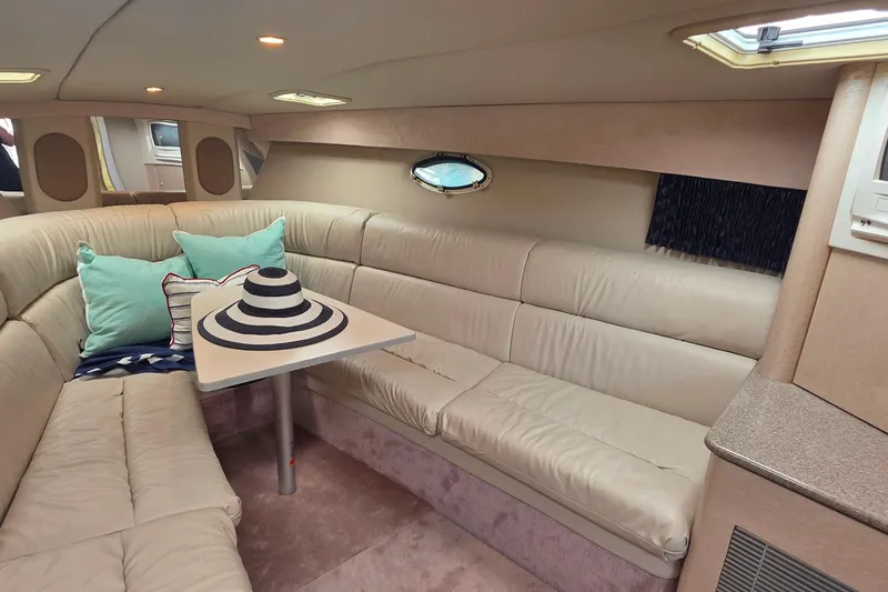Slide: The Image of Interior of 2002 Formula 370 Super Sport yacht with beige seating and decorative pillows. - 38