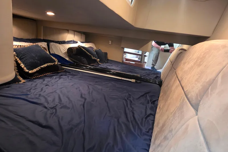 Slide: The Image of Interior cabin of 2002 Formula 370 Super Sport with blue bedding and pillows. - 39